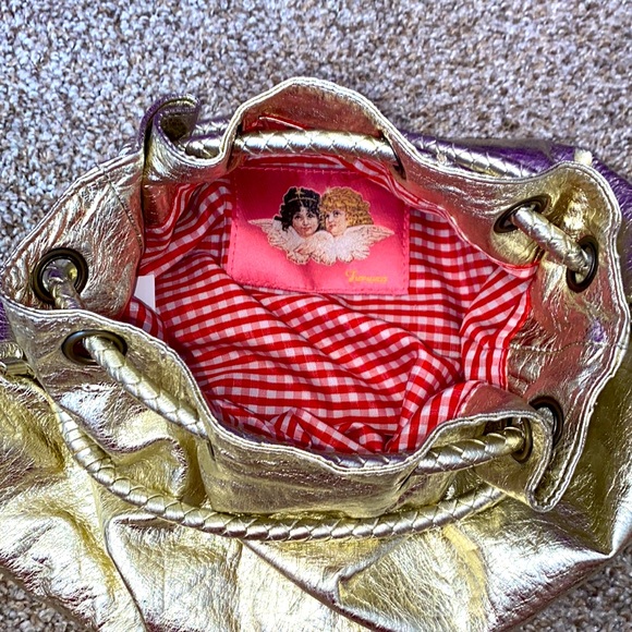 Fionucci bag shell :100% polyurethane lining:100% polyester.Button to close. - Picture 4 of 5